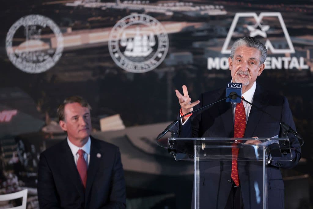 Monumental Sports & Entertainment CEO Ted Leonsis speaks as Virginia Gov. Glenn Youngkin looks on during the announcement of a new sports arena for the Washington Wizards and Washington Capitals.