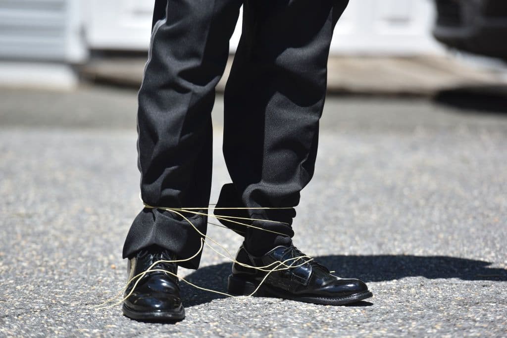 Like tying shoes together, but from a distance. (Marvin Joseph/The Washington Post via Getty Images)