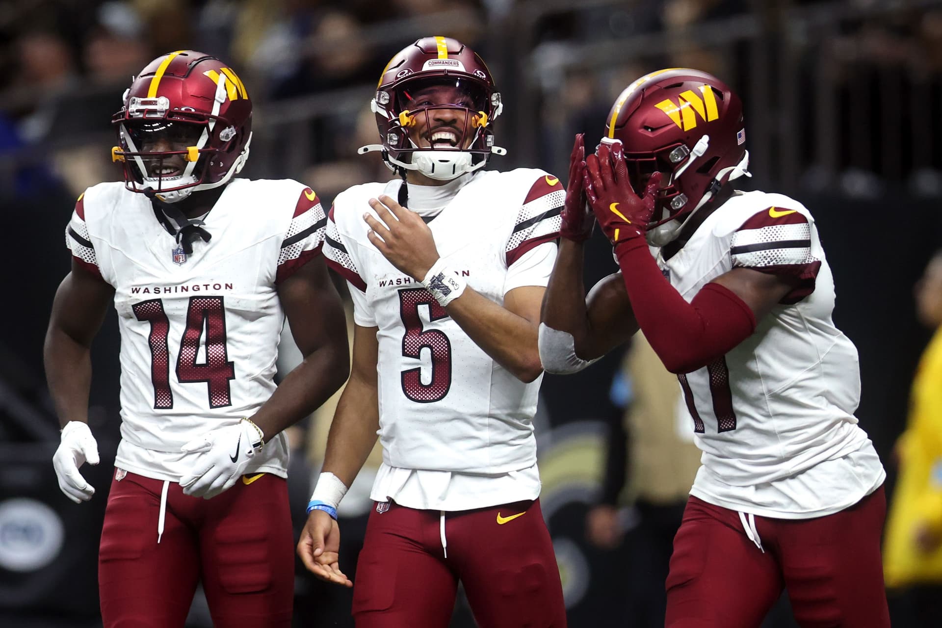 Rookie QB Jayden Daniels celebrates after throwing a pass for a touchdown against the New Orleans Saints on Dec. 15.