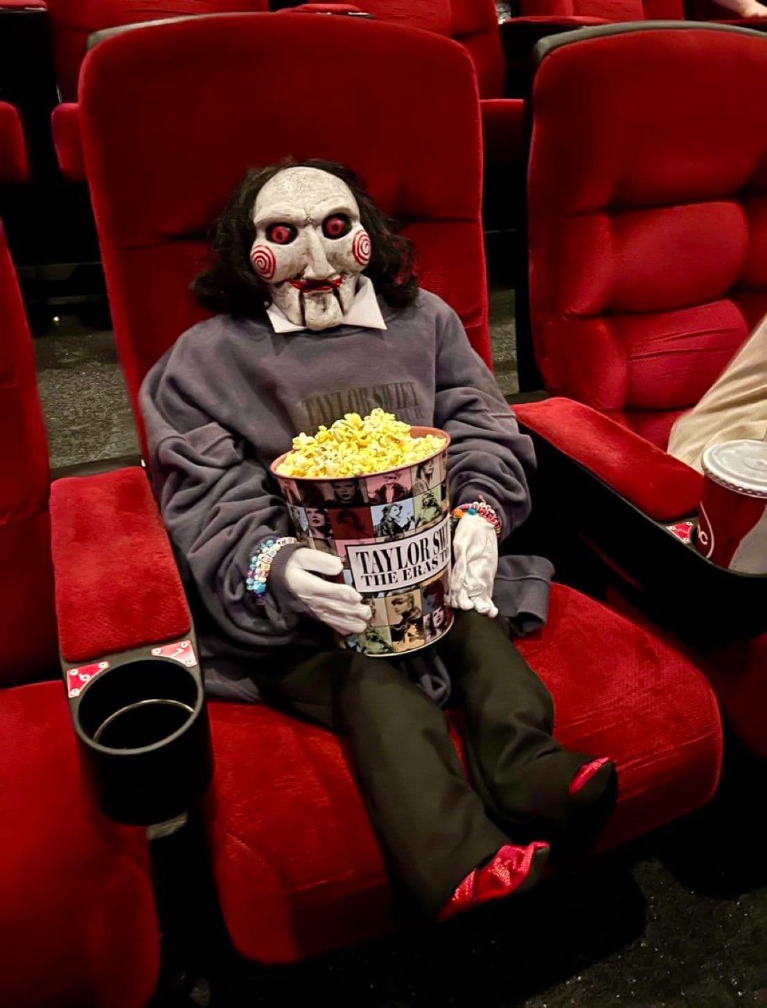 Billy the Puppet taking a break from terrorizing moviegoers to cheer on Taylor Swift.
