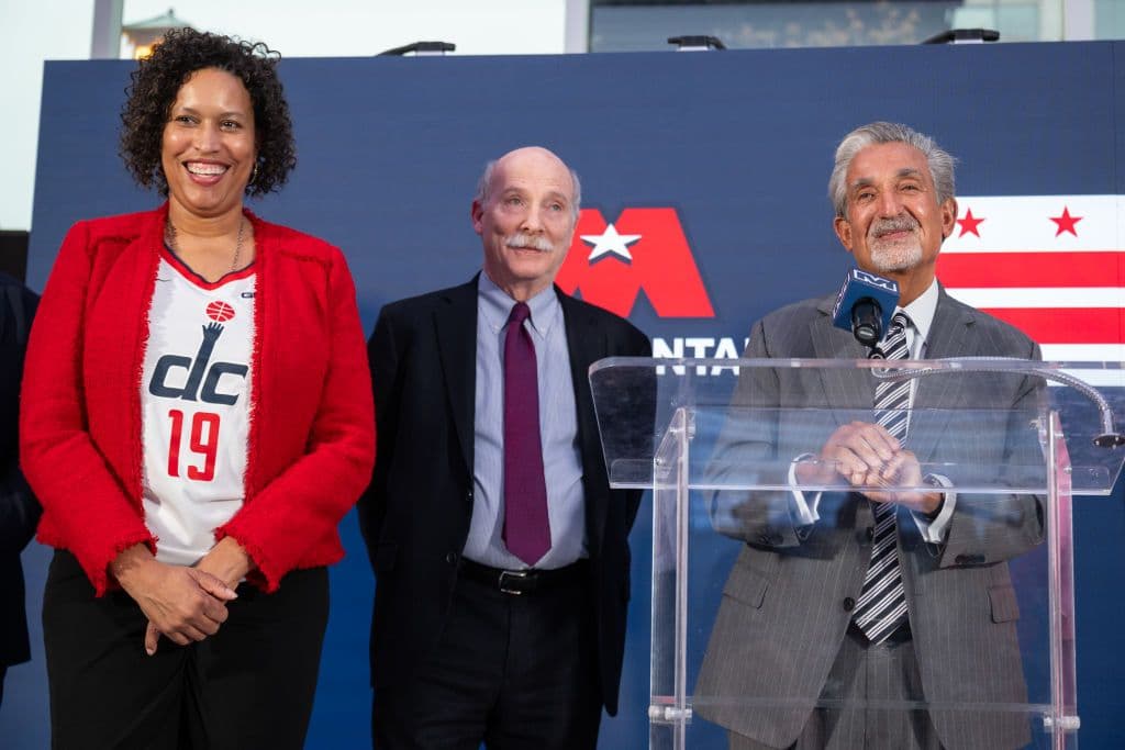 Mayor Bowser, D.C. City Council Chairman Phil Mendelson, and Monumental Sports owner Ted Leonsis (left to right) looking happy as clams during a press conference announcing the Chinatown arena deal