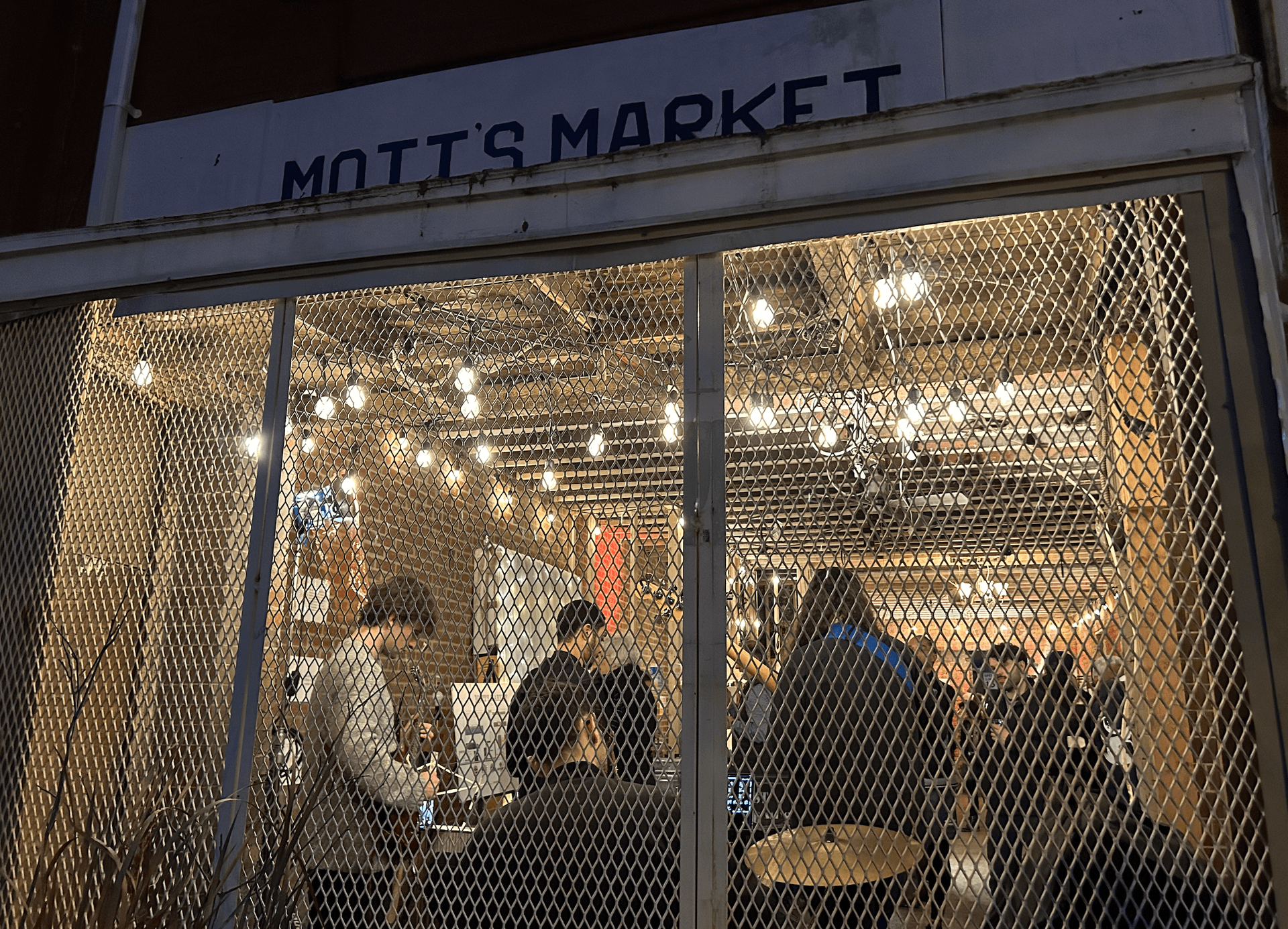A neighborhood get-together at community-owned Mott’s Market.