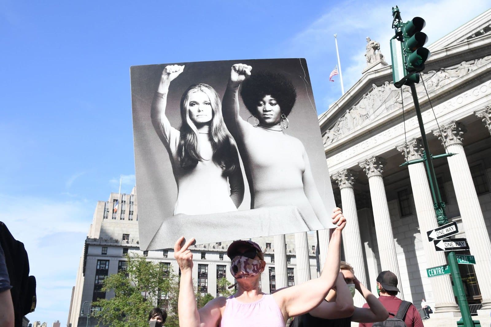 A protester holding a poster featuring women’s rights activists Gloria Steinem and Dorothy Pitman Hughes during a Black Lives Matter rally in 2020.