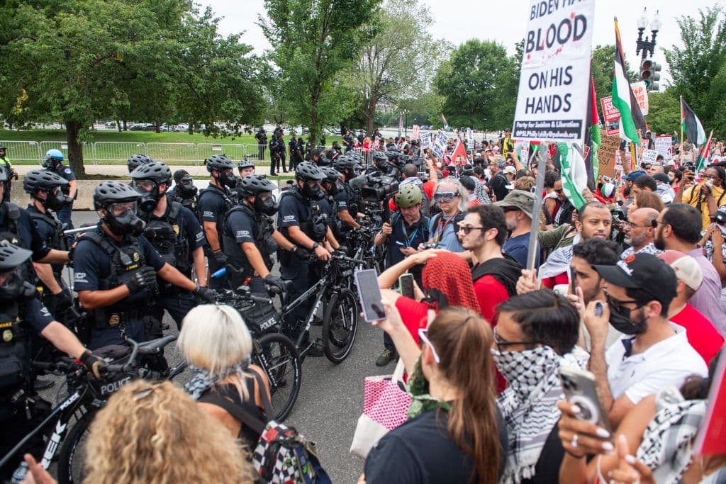 Police and pro-Palestine protesters face off near the Capitol on July 24.