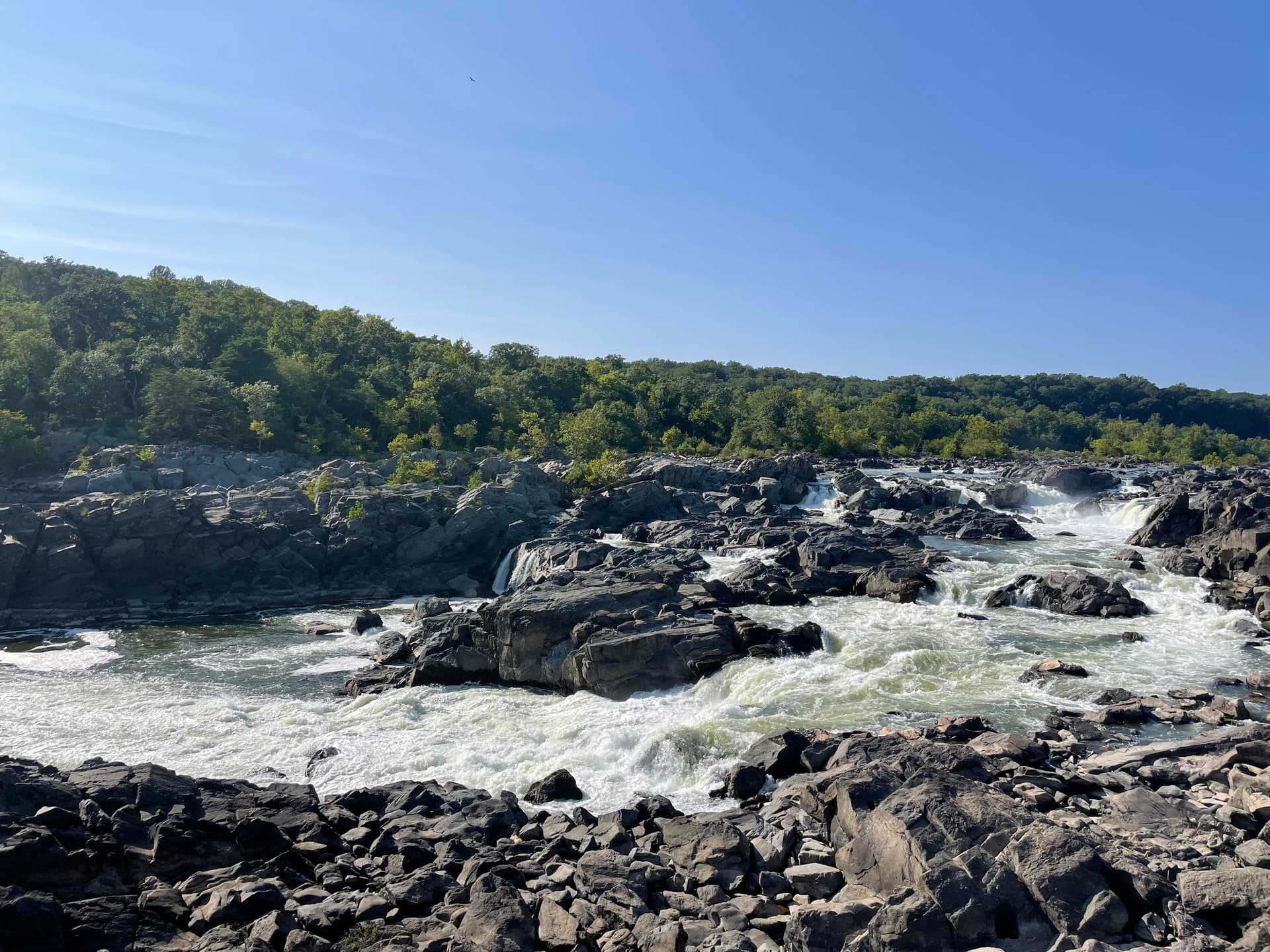 A river runs through jagged rocks.